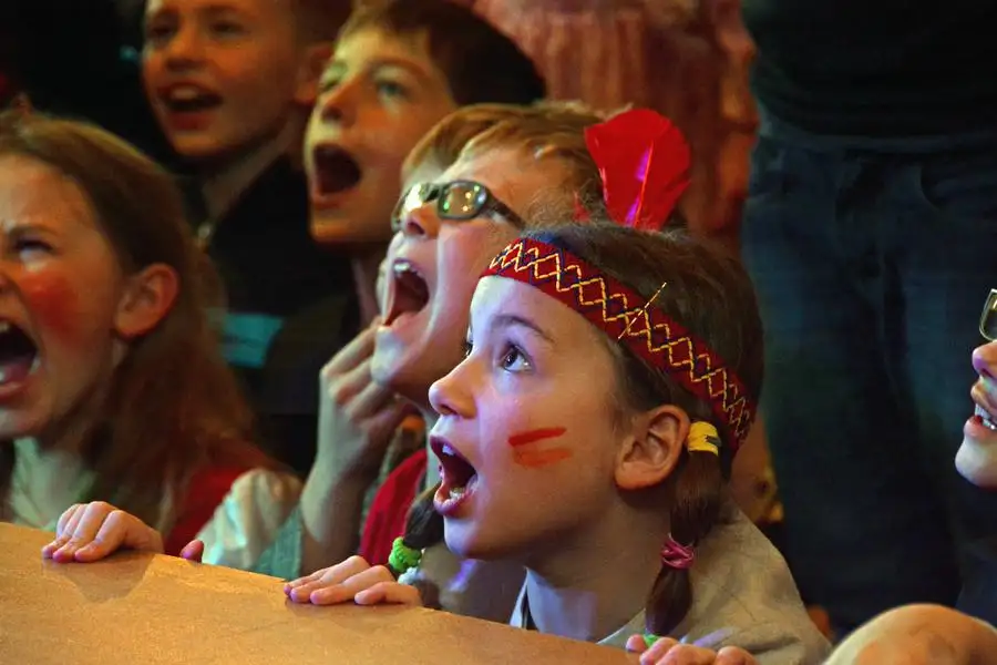 Amazed children at a magic show in NRW
